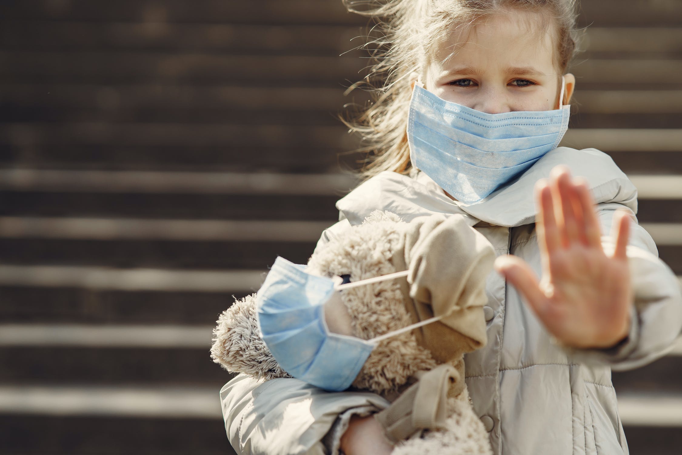 A child with an Adult Face Mask